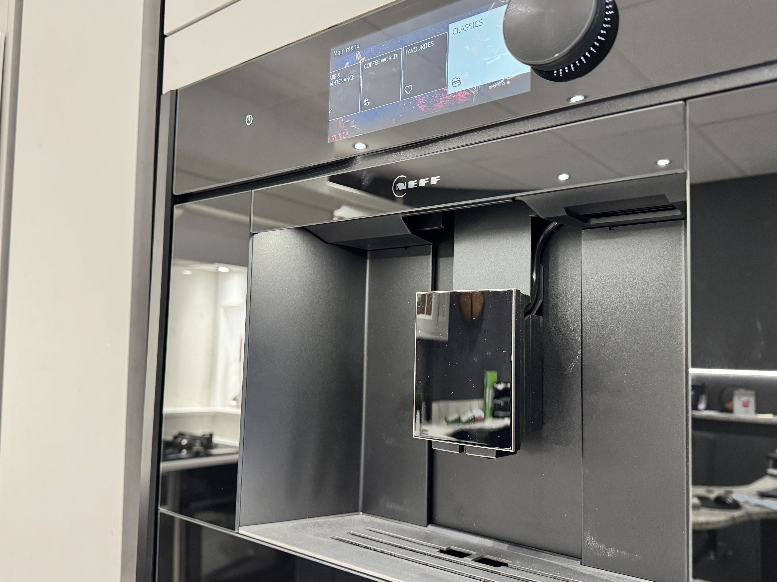 Kitchen worktop surface and wine champagne fridge with door open